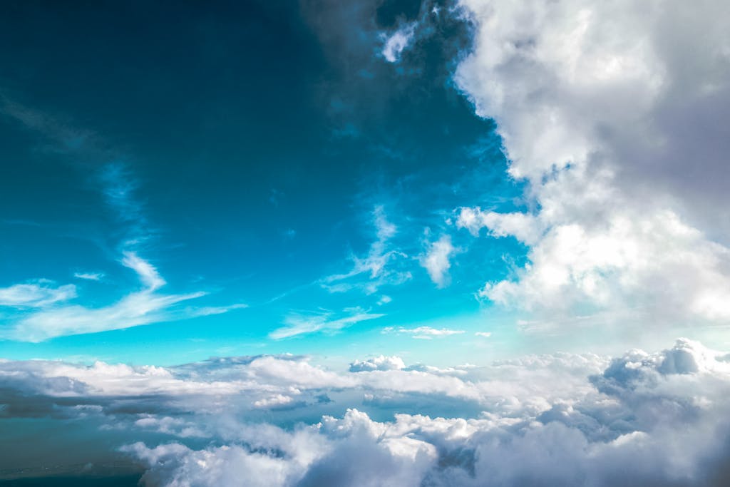 Breathtaking view of clouds with vibrant blue sky above, offering a dreamy skyscape